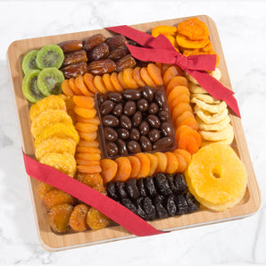 Dried Fruit and Chocolate Nuts on Bamboo Cutting Board Serving Tray